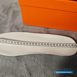 QC Hermès Bouncing Sneakers in a khaki or brown technical mesh and white suede colorway