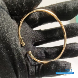 QC Tiffany & Co. T Wire bracelets in 18k yellow gold with mother-of-pearl inlay