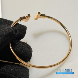 QC Tiffany & Co. T Wire bracelets in 18k yellow gold with mother-of-pearl inlay