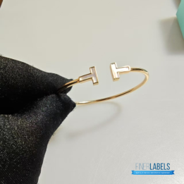 QC Tiffany & Co. T Wire bracelets in 18k yellow gold with mother-of-pearl inlay