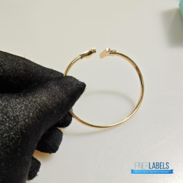 QC Tiffany & Co. T Wire bracelets in 18k yellow gold with mother-of-pearl inlay