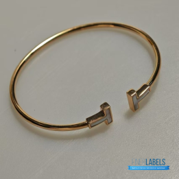 QC Tiffany & Co. T Wire bracelets in 18k yellow gold with mother-of-pearl inlay