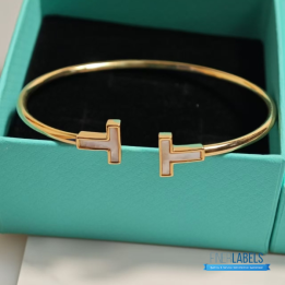 QC Tiffany & Co. T Wire bracelets in 18k yellow gold