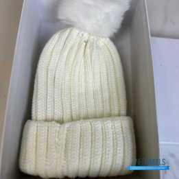 Moncler Ribbed Wool Beanie in White with a fur Pom Pom