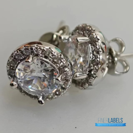 Tiffany & Co. Sterling Silver Moissanite Stud Earrings featuring a classic halo design.
