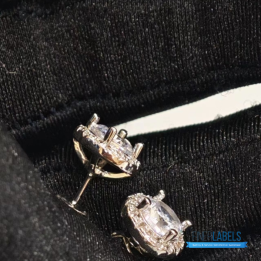 Tiffany & Co. Sterling Silver Moissanite Stud Earrings featuring a classic halo design.
