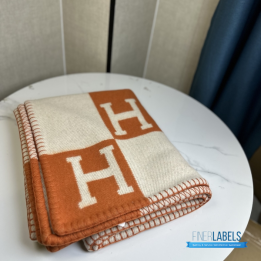 Hermès Avalon Throw Blanket in the iconic orange and ecru colorway
