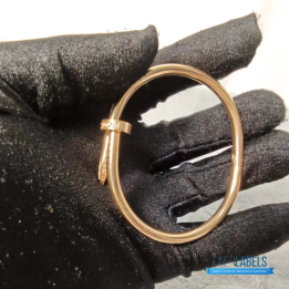 QC Cartier Juste un Clou Bracelet in a rose gold nail design