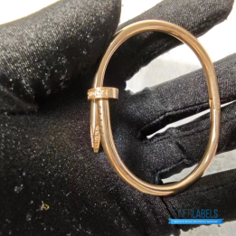 QC Cartier Juste un Clou Bracelet in a rose gold nail design