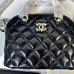 Chanel Shiny Lambskin Quilted Coco Clutch with Chain in black