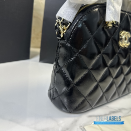 Chanel Shiny Lambskin Quilted Coco Clutch with Chain in black