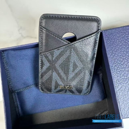 QC CD Saddle Magnetic Card Holder featuring black grained calfskin and a black Dior Oblique jacquard pattern with the Dior signature
