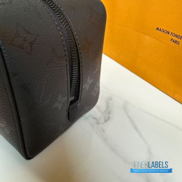 QC LV Locker Dopp Kit crafted in a dark canvas with an embossed tonal monogram pattern