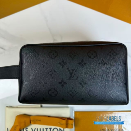 QC LV Locker Dopp Kit crafted in a dark canvas with an embossed tonal monogram pattern