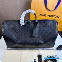 QC LV Keepall Bandoulière travel bag featuring a tone-on-tone Monogram canvas
