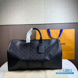 QC LV Keepall Bandoulière travel bag featuring a tone-on-tone Monogram canvas
