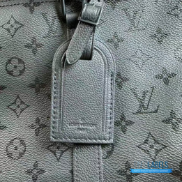 QC LV Keepall Bandoulière travel bag featuring a tone-on-tone Monogram canvas