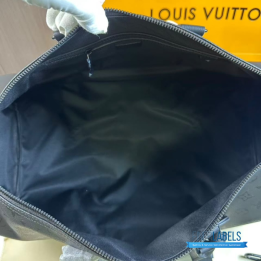 QC LV Keepall Bandoulière travel bag featuring a tone-on-tone Monogram canvas
