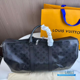 QC LV Keepall Bandoulière travel bag featuring a tone-on-tone Monogram canvas