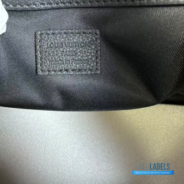 QC LV Keepall Bandoulière travel bag featuring a tone-on-tone Monogram canvas