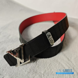 Louis Vuitton Reversible Belt featuring a textured black strap and red lining