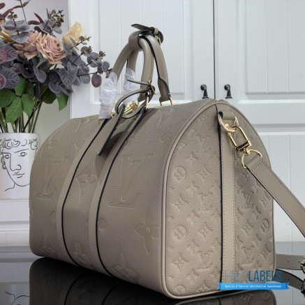 LV Keepall Bandoulière 45 (Tourterelle Monogram Empreinte Giant Leather)