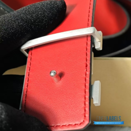 QC Louis Vuitton Reversible Belt featuring a textured black strap and red lining