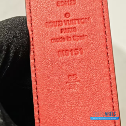 QC Louis Vuitton Reversible Belt featuring a textured black strap and red lining