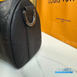 QC LV Keepall Bandoulière 25 crafted in black embossed monogram leather with matching dark hardware