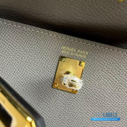 QC Hermès Kelly 20 cm Désordre handbag in a grey shade