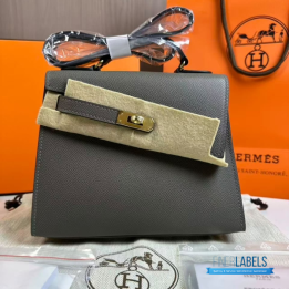 QC Hermès Kelly 20 cm Désordre handbag in a grey shade