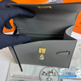 QC Hermès Kelly 20 cm Désordre handbag in a grey shade